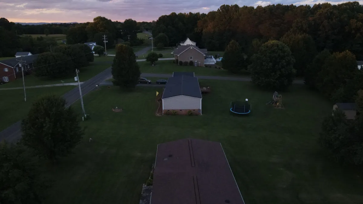 Aerial drone shot of rural North Carolina homes at sunset