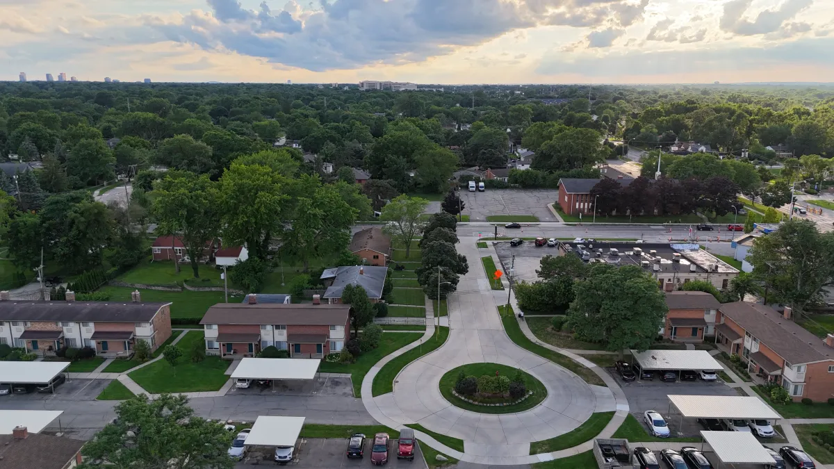 Aerial drone shot of a suburban cul-de-sac at golden hour